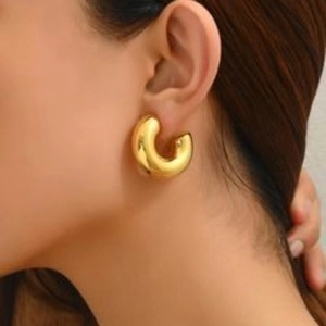 Minimalist chunky golden C-shaped hoop earrings for women with polished finish