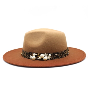 Detail of wool felt fedora featuring leopard print band with pearls and floral beads