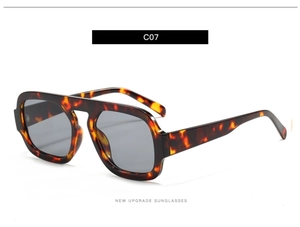 Close-up of stylish tortoise shell aviator sunglasses with high-quality dark grey lenses