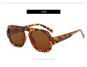 Detailed view of tortoise shell aviator sunglasses with brown lenses and wide temples