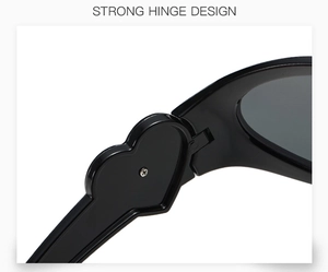 Detailed view of strong heart-shaped hinge on black Y2K fashion sunglasses