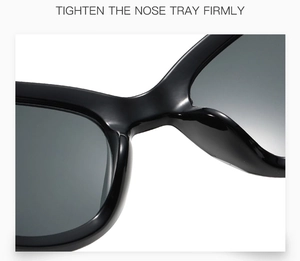 Detail of sturdy integrated nose pads on black Y2K heart sunglasses with glossy finish