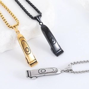 Barber razor pendant necklaces in gold, black, and silver stainless steel on white stones