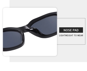 Detail of integrated nose pads on lightweight black rectangular sunglasses