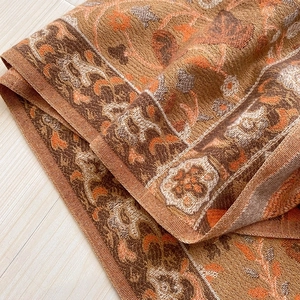 Ethnic floral paisley shawl wrap with fringe made of warm pashmina fabric in brown and orange