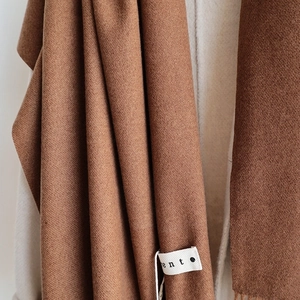 Brown cashmere-like winter scarf with soft tassels and minimalist fente brand tag