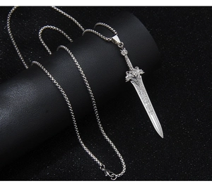 Detailed view of silver sword pendant with lion emblem and textured metal finish