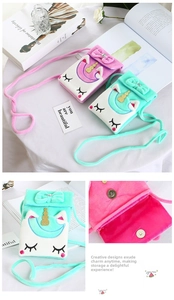 Detailed view of the unicorn plush bag showing secure magnetic metal closure
