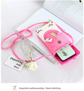 Internal view of pink plush unicorn crossbody bag showing mobile phone storage capacity