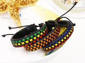 Close-up of woven leather bracelets with colorful checkered patterns and adjustable drawstrings