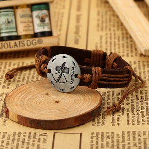 Macro detail of retro Sagittarius leather bracelet with adjustable woven cords and pendant
