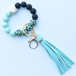 Leopard print silicone bead wristlet keychain with mint green tassel and wooden bead