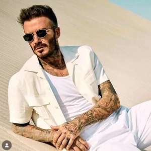 Vintage metal sunglasses with diamond frame worn by a man in a desert fashion setting