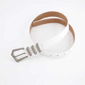 Detailed view of white leather belt with silver polygonal buckle and three metal keepers