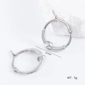 Detailed view of silver irregular coiled hoop earrings with 21mm size and 5g weight