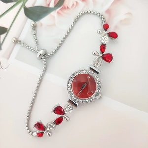 Elegant floral silver watch with red teardrop crystals and sparkling rhinestones