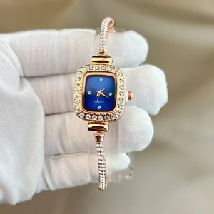 Elegant gold square watch for women featuring a blue dial and sparkling rhinestones