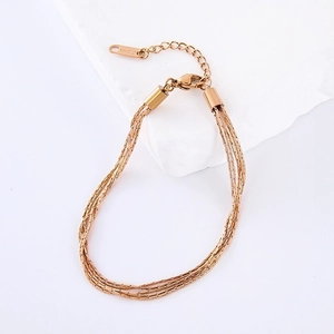 Detailed view of layered rose gold snake chains made of stainless steel with lobster clasp