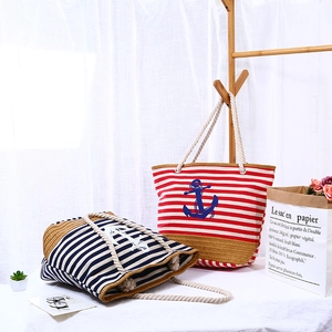 Striped canvas beach tote bag with nautical anchor motif and rope handles