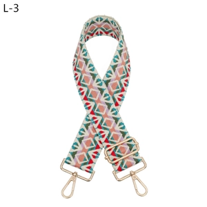 Close-up of bohemian colorful diamond pattern woven strap with gold metal lobster clasps