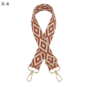 Detail of adjustable geometric diamond jacquard strap with gold-tone swivel metal hooks