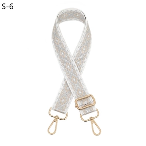 Adjustable wide replacement bag strap with white and silver diamond pattern and gold hardware