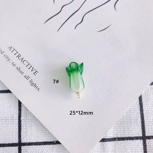 Macro view of 25x12mm green glass cabbage charm for DIY jewelry making projects
