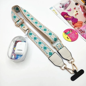 Adjustable woven phone strap with beige geometric pattern and clear zipper pouch