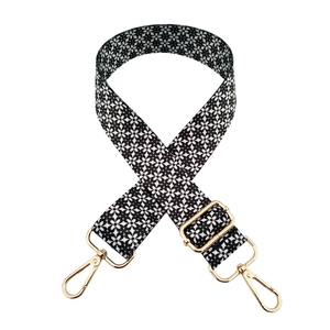 Adjustable wide replacement strap with black and white floral pattern and gold hardware
