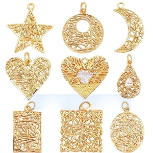 Detailed grid of nine handmade copper pendants with star moon heart and lace wire patterns