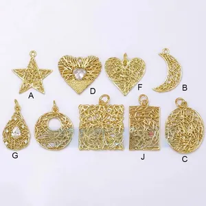 Detailed view of nine assorted brass wire-wrapped hollow star and moon pendants