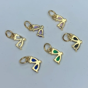 Gold butterfly wing pendants with colorful zircons set in a circular layout display