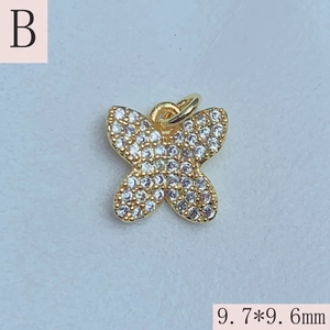Detailed view of cubic zirconia butterfly charm in gold finish, size 9.7x9.6mm