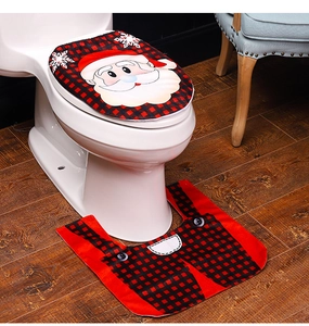 Detailed view of red plaid Santa toilet lid cover and matching non-slip bathroom rug set