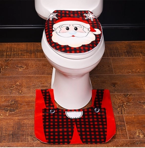 Detailed view of 2-piece Christmas Santa Claus toilet lid cover and floor mat in red plaid