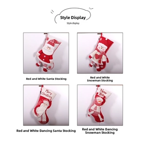 Detail of four festive knitted Christmas stockings with 3D Santa and Snowman characters