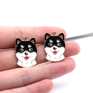 Detail of handmade enamel shiba inu dog charms for DIY earrings and keychains