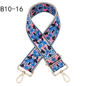 Close-up of bohemian jacquard woven bag strap with golden metal lobster clasps