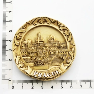 Detailed view of a Prague souvenir resin fridge magnet with 7.5cm diameter ruler measurement