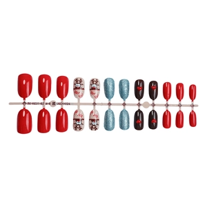 Christmas themed press-on nails set with Santa, reindeer, glitter and snowflake designs