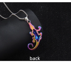 Macro detail of the iridescent lizard pendant back with polished metallic finish