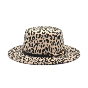 Detail of leopard print fedora hat featuring black leather strap and golden metal buckle