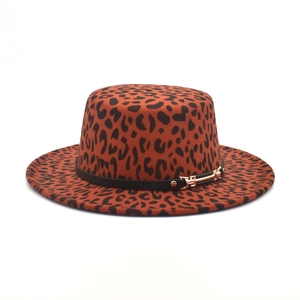 Detail of leopard print boater hat featuring a black band and gold buckle fastener