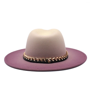 Detail of gradient felt fedora hat transitioning from beige to purple with gold chain