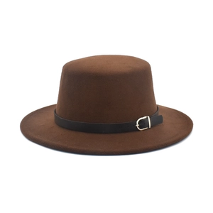 Detail of flat top brown wool felt boater hat with black leather band and gold buckle