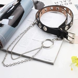 Punk style black PU leather belt with silver eyelets and double metal chains on a magazine