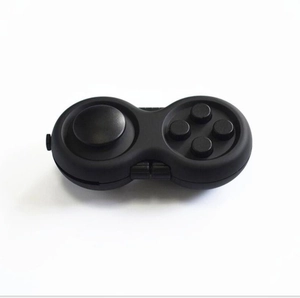 Detailed close-up of a black fidget controller toy with joystick and silicone buttons