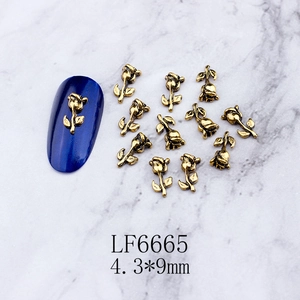 Detailed macro view of retro gold metal rose nail art charm LF6665 sized 4.3x9mm