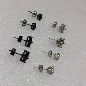 Unisex 4-pair set of round and square cubic zirconia stud earrings in black and silver