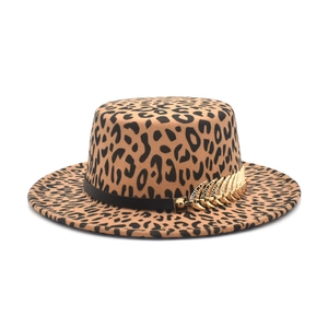 Leopard print flat top fedora hat with a black band and gold feather metal accessory
